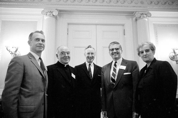 Governor Vernon W. Thomson pictured with the new officers of the Governor's Commission on Human Rights. Left to right are: Dr. G. Aubrey Young, pastor of the First Presbyterian Church, Waukesha; Rev. Franklyn J. Kennedy, Milwaukee, editor of the Catholic Herald Citizen; Governor Thomson; Peter Pappas, LaCrosse, retiring chairman; and Mrs. Alice (Melvin) Bonn, Bloomington.
