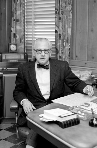 Portrait of <i>Wisconsin State Journal</i> editor, Roy Matson, sitting at his desk.