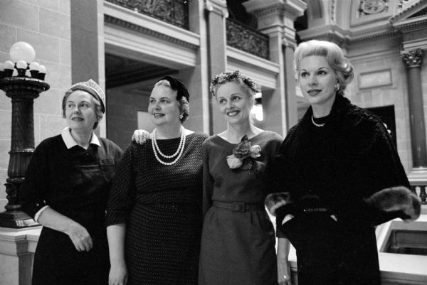The four journalists who have been asked to speak for the traditional "ladies night" program of the Madison Advertising Club at the Cuba Club. They are (left to right): Luella Mortenson of WKOW-TV; Louise Marston, society editor of the Wisconsin State Journal; Lynn Honeck, wife of Wisconsin's attorney general; and Beverly Stark of WMTV.  