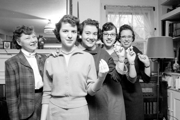 Madison's four DAR (Daughters of the American Revolution) Good Citizenship winners receive their pins. They are (left to right): Francesca Axley, who made the presentation in her home; Joanne Lillywhite, Carol Moir, Penny Brown, and Nancy Munson.