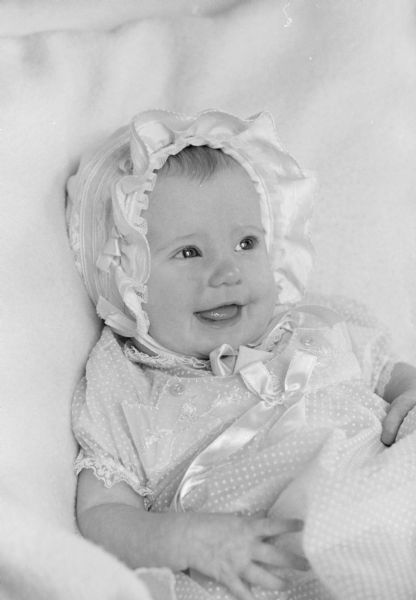4-month-old Mary Louise Rodgers, daughter of Mr. & Mrs. F. Ray Rodgers, is shown wearing her dainty pink Easter bonnet.