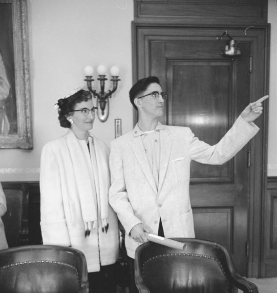 18-year-old Pat Stoycheff is shown with his mother, Mrs. George Stoycheff, in Gov. Vernon Thompson's office prior to his 8-day trip to Spain as "Young Columbus" winner over 1,100 other newspaper carrier boys.