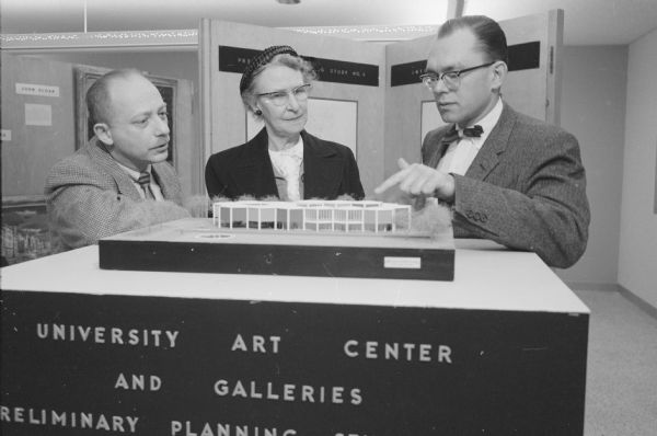 Looking at a model of the future gallery for the newly dedicated Wisconsin Center building on the University of Wisconsin campus are Aaron Bohrod, university artist-in-residence (left), Ruth Porter, and Leo Jakobson, the gallery designer.