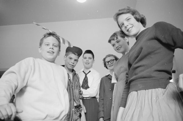 Seventh-grade pupils of Lakewood school to present the play "Like Father, Like Son" in the school gymnasium. The cast includes, left to right: Jamie Halverson, Steve Walrath, Dick Holcomb, Mary Breiby, Sue Cotter, and Gwen McLean.
