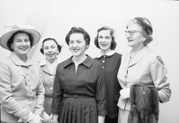 Members of Alpha Gamma Delta sorority celebrating their annual international reunion day at the University of Wisconsin. Shown are: Mrs. Harold Eberhardt, Minneapolis, MN; Mrs. J.N. Bond, Hartland; Esther Manthei, Ila Mohs, and Mrs. Thora Ragone, all of Madison.
