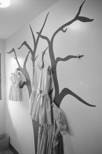 New home, located at 4121 Chippewa Drive, designed by owners Martin and Ann Wolman to meet the needs of their large family of five children. Shown is a wall in the laundry area decorated as a "laundry tree" — a place to hang ironed clothes.