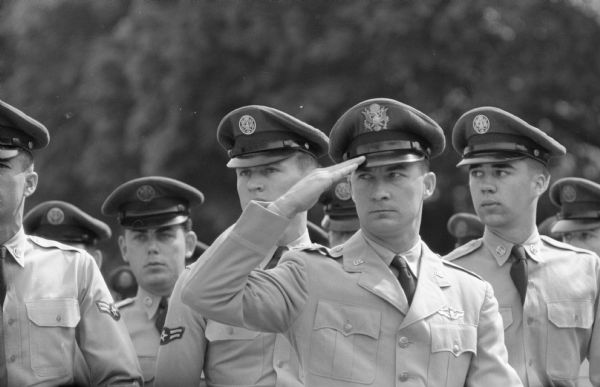 An officer salutes during the parade at the Capitol Square for the Armed Forces Day air show and parade.