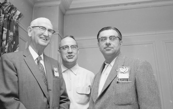 Three men behind the scenes at the district convention of Optimists International at Hotel Loraine. Left to right are: M.C. Reppen, nominating committee chairman and winner of the "Friends of the Bay" award; Richard F. Nazette, Cedar Rapids, Iowa, past vice-president; and Dr. A.T. Gowron, Winnipeg, Canada.