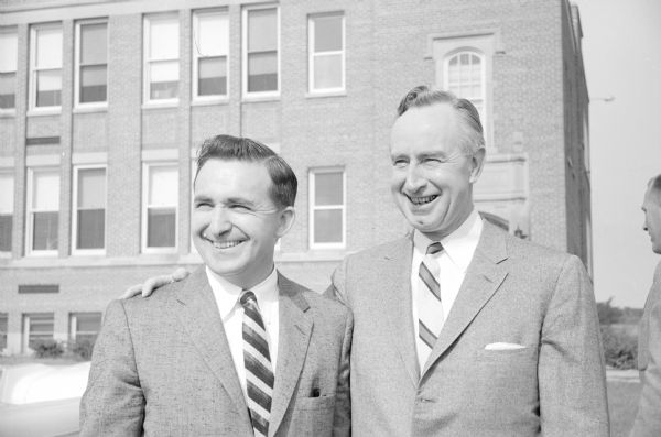 Maurice Reese, left and Gov. Vernon Thomson standing outdoors. Reese is division manager for the Federal Life Insurance Company, and has announced that he is a candidate for the Republican nomination for the Assembly from the Eastern District of Dane County.