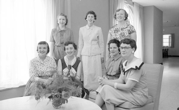 Group portrait of committee chairmen for the Edgewood College Alumnae chicken barbecue. Seated, left to right: Mrs. Norbert Esser, Mrs. James Rose, Ann Sweeney and Dorothy Bowar. Standing are Betty Jacques, Marcia Corcoran and Mrs. Jerry Emmerich.
