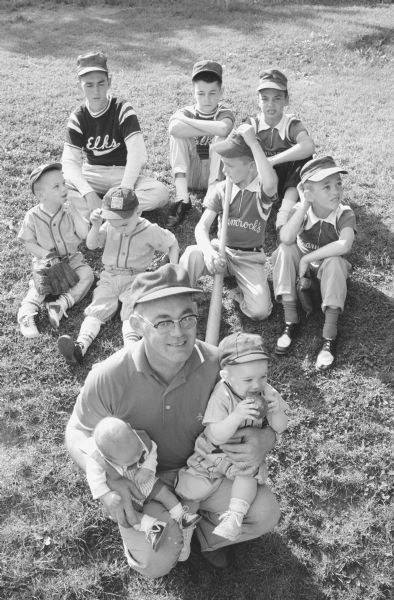 Raymond E. Sweeney with his nine sons.