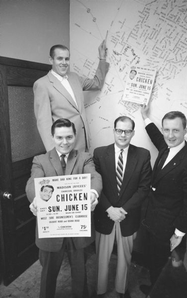Members of the Madison Junior Chamber of Commerce prompt their charcoal broiled chicken dinner held at the West Side Business Men's Club, Gilbert Road. Shown are Jerry Padgham, 131 Marquette Street, (rear) and (L-R front) Dan Matthews, 5372 Shaw Court; Robert Collins, 2106 Center Avenue; and Ed Hobbins, 309 New Castle Way.   