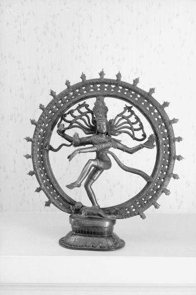 A decorative art piece depicting the Hindu god, Shiva, stands on a bookcase in the home of Agatha Fowlkes on Cambridge Road.