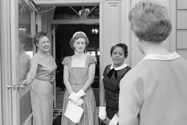 Wisconsin's first lady, Helen Thomson (left), greets three of the foster mothers who were honored at a tea in the executive mansion. Being greeted are Evelyn Morris, Judy Circle, and Constance Boles.