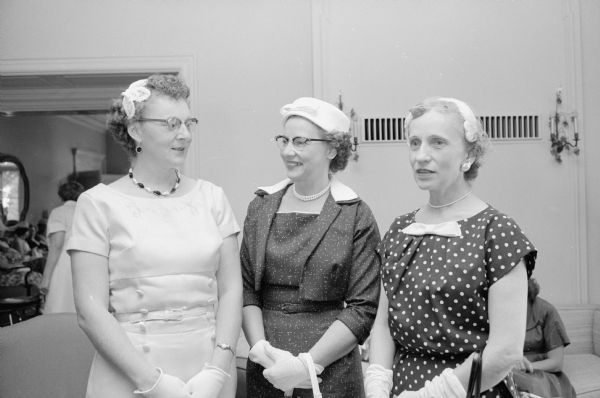 Mrs. Marvel Albright (right), a Dane county social worker, visits with Margaret Olson (Madison) and Mrs. Charles Berend (DeForest) at a tea for Dane county foster mothers at the Wisconsin Governor's Mansion.