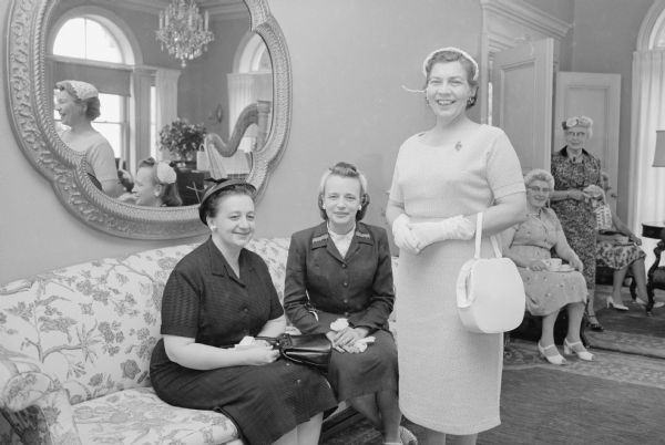 Three women who attended the Foster Mothers of Dane County tea at the Wisconsin executives mansion. Pictured are Margaret Straub, head resident at Blessed Martin home; Mrs. Chester McCafferty, a foster mother; and Evelyn Owens, chairman of the foster home committee of the Community Welfare Council.
