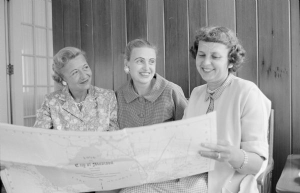 Discussing plans for the Women's division of the United Givers' Fund are, left to right: Constance Helmquist, Elizabeth Schlotthauer, and Helen Quisling.