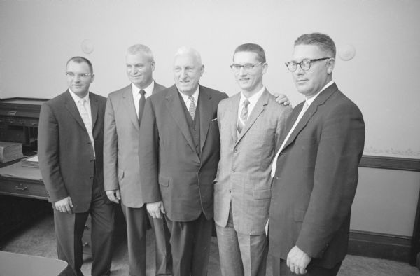 Father and four sons who are attorneys at the Hartman law firm of Juneau. The Hartman family partners are, from left: George, Jr.; Leo C.; father George A., Sr.; David P. (who was just admitted to the practice of law); and Robert G.