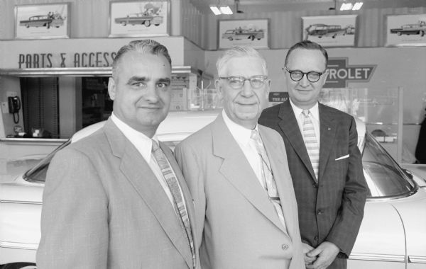 Officers of Hult's Capital Garage, with a combined ninety years of service with the organization. Left to right are: George E. Lambrecht, secretary; Ralph Hult, president; and Clarence J. Thorstad, newly elected vice-president and treasurer. 