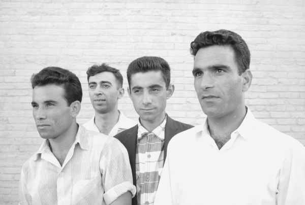 Four Iraqi University of Wisconsin students state that Arab students support the revolt in Iraq, referring to the July 14th Revolution which overthrew King Faisal II and established the Iraqi Republic. The students are, left to right: Hamid Alwan, Alauddin Sarnarrai, Mustafa Jaff, and Mehsin Alwan, all from Baghdad.
