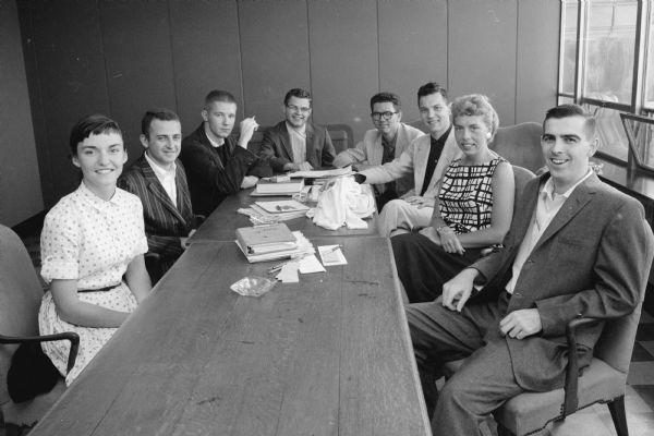 University of Wisconsin Summer Prom Committee, (L to R): Sheila Campbell, Robert Gill, Kurt Brokaw, Wendell Langman, Frank Parsons, Bruce Creger, and Beverly Hansen. The man on the far right is not identified.