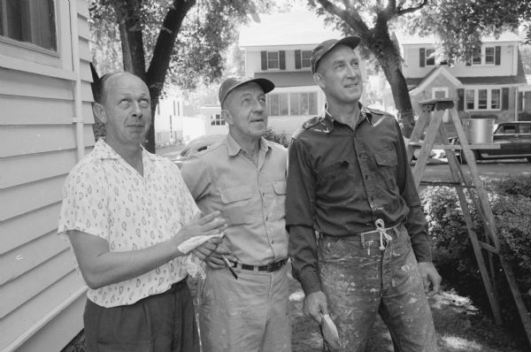 Norbert Anderson's friends who pitched in to help paint his home at 1522 Jefferson Street. Checking out their painting job are, from left; Joe Frye; Lorin Briese, Whitewater; and Robert Cromey, Middleton.    