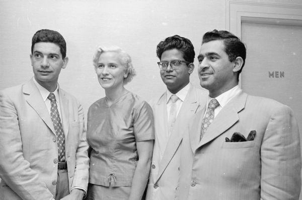 One in a series featuring faculty and students who participated in a nine week orientation economic study for foreign students. Present at the closing ceremony were, left to right: Angel L. Boccia, Argentina; Ruth Liddle, chair of the Madison Friends for Foreign Students; Mohammed O. Fauk, Pakistan; and Sadiq R. Saleh, Iraq.