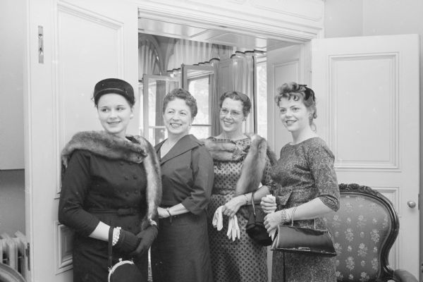 Members of the Madison Dental Hygiene Association hold a tea at the Governor's Mansion in Maple Bluff. Shown are members of the state hygienist association who were special guests at the tea. Shown (L-R) are: Mary Donovan, state secretary, 1 Langdon Street; Mrs. Vernon Thomson, hostess of the tea and wife of Governor Vernon Thomson; Mrs. Lillian Teletzke, Milwaukee, state president-elect; and Elizabeth Pitz, state president, 1 Langdon Street.     