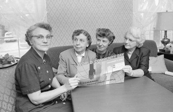 Madison church women plan to join United Church Women throughout the world to observe World Community Day. The service is held at the First Evangelical United Brethren Church, 223 Wisconsin Avenue. Planning for the event are members of the Madison Council of United Church Women shown, (L-R): Mrs. Evert Wallenfeldt, 2238 Hollister Avenue, First Congregational Church, event chairman; Mrs. Frederick L. Browne, 3546 Lake Mendota Drive, council president; Mrs. T. Dwight Hunt, 204 Highland Avenue, Christ Presbyterian Church, co-chairman; and Mrs. John L. Lonergan, 2227 Commonwealth Avenue, First Congregational Church, devotions chairman.