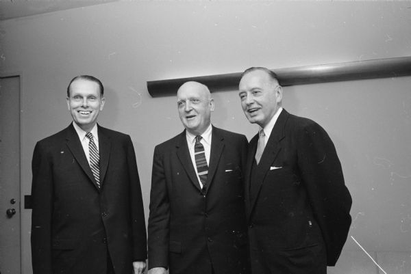 Dr. Conrad A. Elvehjem (left), the new president of the University of Wisconsin, is greeted by former U.W. president Dr. E.B. Fred (middle) at the inaugural luncheon at the Memorial Union. Man on the right Dr. Grayson Kirk, president of Columbia University and keynote speaker at the inaugural.