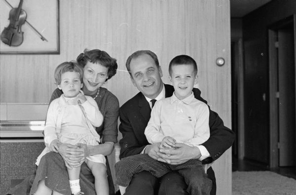 Portrait of Governor-Elect Gaylord Nelson with wife Carrie Lee Nelson, and children Cynthia (Tia) (3) and Gaylord, Jr. (Happy) (5) taken at the family home at 5627 Crestwood Place prior to the family moving into the Governor's Mansion in Maple Bluff.