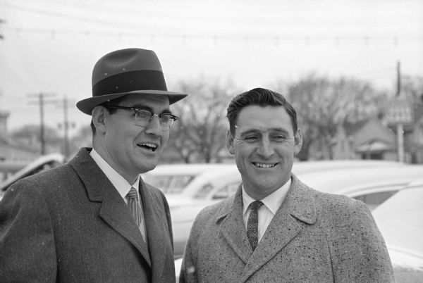 John L. Wolf (right), a Madison automobile salesman from Black Earth, welcomes his brother, Leonard G. Wolf, who is a newly-elected congressman from Iowa.
