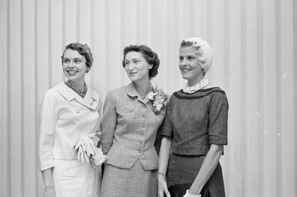 The wife of Wisconsin's governor-elect, Carrie Nelson (center), was honored at a luncheon by the Democratic women of Dane county. With her are the wives of two Wisconsin national legislators: Mrs. Dorothy Kastenmeier of Watertown (left) and Mrs. Ellen Proxmire. 
