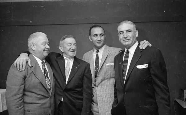 Four of the 142 who attended the annual Rounder's Club Christmas party are, left to right: Sam Olson, Ed Stoeber, Frank Torre, and Art McCance. Torre, the Milwaukee Braves first baseman, was a special guest.