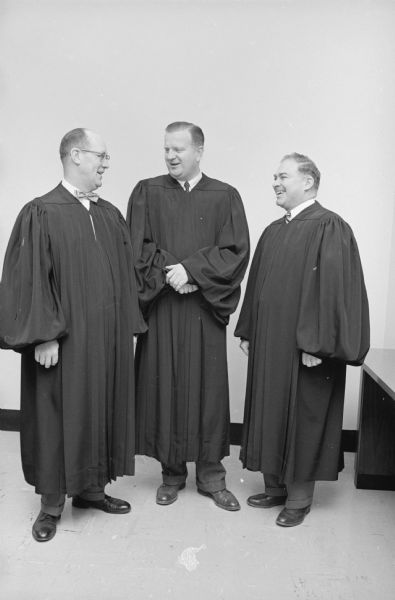Circuit Judges Norris E. Maloney, Richard W. Bardwell, and Edwin M. Wilkie "model" new robes they will start wearing in the new year.