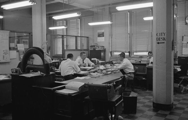 <i>Wisconsin State Journal</i> newspaper city room. Photograph taken for the 10th anniversary of the newspaper moving to the publishing of a morning edition.   