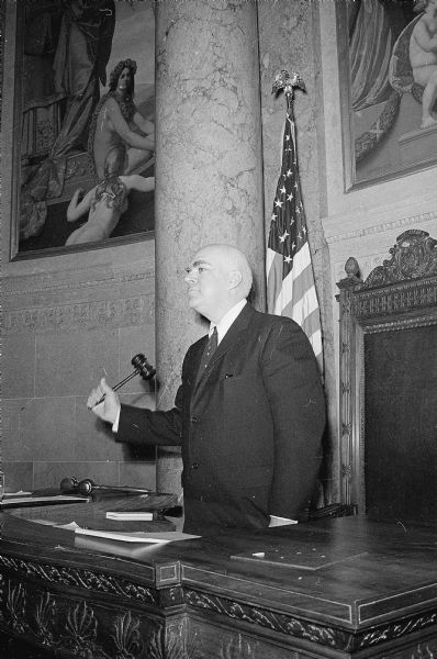 Lieutenant Governor Philleo Nash gavels the Wisconsin State Senate to order for the 1959 session. He is a Democrat from Wisconsin Rapids.