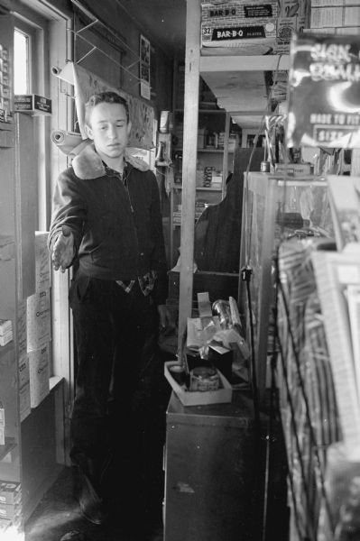 Richard Kellor, son of the owner Carroll Kellor, standing in an aisle of Kellor's Lakeview Store, the site of a possible robbery. The store is located on Highway 14 and B, south of Madison.