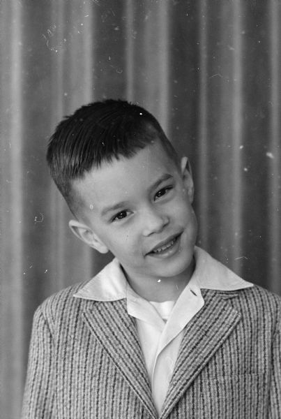 Portrait of Peter McKenna, one of seven kindergarten students at the Edgewood campus school whose photograph is featured in a newspaper article about the "little people" of Ireland such as leprechauns and banshees.