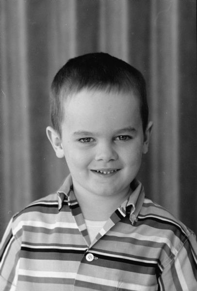 Portrait of Dennis Kennedy, one of seven kindergarten members of the Edgewood campus school whose photograph is featured in a newspaper article about the "little people" of Ireland such as leprechauns and banshees.