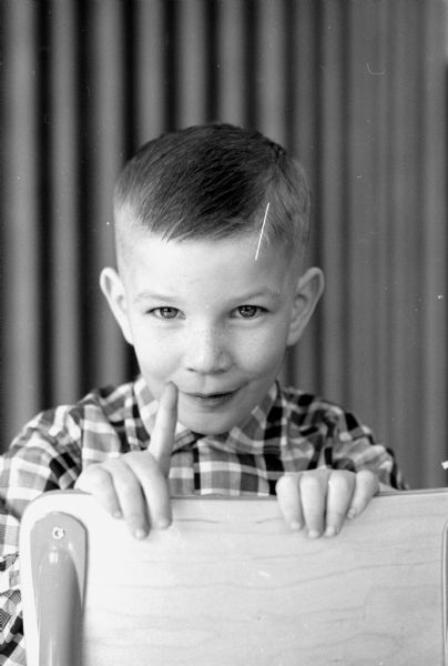Portrait of Steven Riley, one of seven kindergarten students of the Edgewood campus school whose photograph is featured in a newspaper article about the "little people" of Ireland such as leprechauns and banshees.