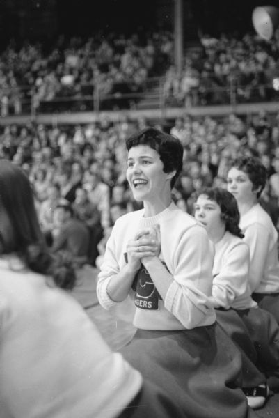 Marilyn Otto, LaCrosse Logan High School, cheers for her team at the state basketball tournament played at the University of Wisconsin Field House.