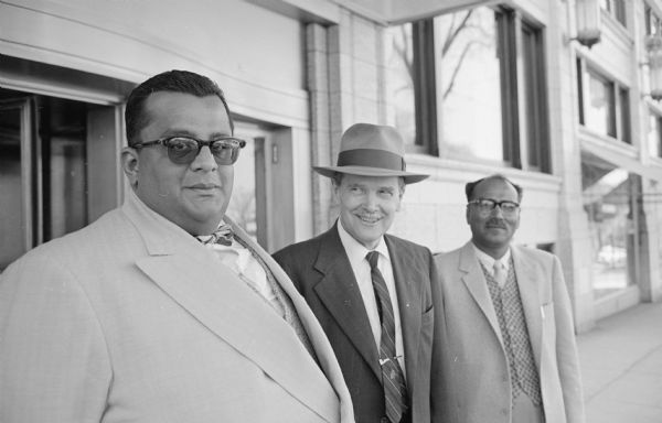 His Highness, the Maharajah of Mysore India, left, being greeted on arrival by Prof. A. Campbell Garnett, center, of the U.W. philosophy department. The person on the right is unidentified. The Maharahjah, who reigns over a south central state in Inda, is a distinguished Indian philosopher and came to Madison to attend a meeting of the American Philosophical Association.