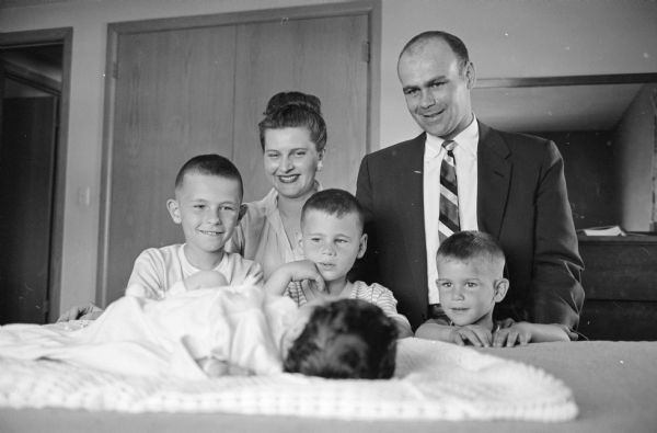Richard & Alice Welch with their three sons, Jon (7), Daniel (5) and Stephan (3) admire the new addition to the family, baby girl Andrea, born on April 30th. The Welch family lives at 4410 Boulder Terrace.