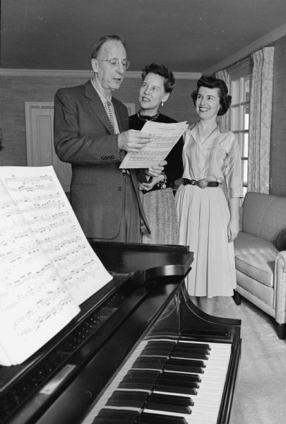 Planning for the first "Pops Concert" staged by the Madison Civic Music Association and performed by the Madison Civic Symphony on April 30th are: L to R: Walter Heermann(?), director of the Madison Civic Symphony; Lucille Kimball, general chairman of the Pops Concert and Viola Fenske, co-chairman. The concert is to be held at the Crystal Ballroom of the Hotel Loraine. Funds collected from the benefit will be used to create a library of arrangements for the Civic Symphony and in other ways to support future concert programs.