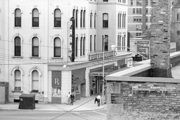 Elevated view of the Park Hotel, 22 South Carroll Street, taken from the rooftop of an adjacent building looking north from South Carroll Street. West Main Street is on the left side of the hotel. The Prescription Pharmacy, 26 South Carroll Street, is on the first floor corner of the hotel.