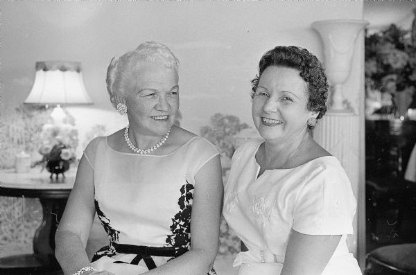 A tea is held to honor Mrs. Margery Kuehn, Whitefish Bay, wife of the Republican candidate for Governor of Wisconsin, Philip G. Kuehn. Among the women assisting at the tea were (L-R) Mrs. Mary Rennebohm, 201 Farwell Drive, wife of the former Governor of Wisconsin, Oscar Rennebohm; and Mrs. Hazel Wheeler, 2441 Fox Avenue, daughter-in-law of Mrs. Jane Campbell, 111 W. Wilson Street, hostess of the tea.