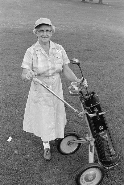 Outdoor portrait of grandmother Mary Brandel with her golf cart. She will be 80 on Jan. 24, 1961. She has two university-age grandchildren.