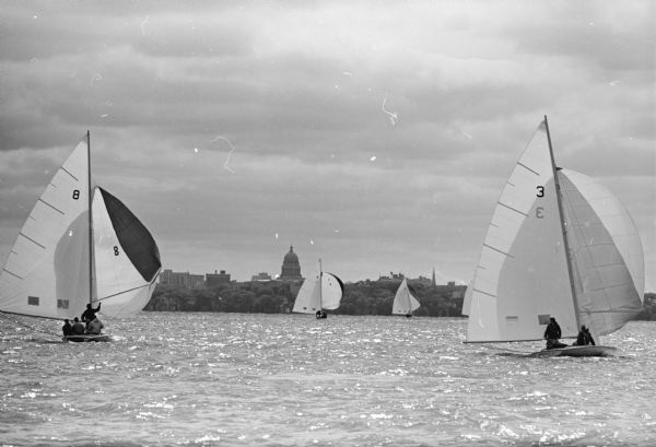 The yachts <i>Ivanhoe</i> (L), skippered by Philip L. Peoples, and <i>Wannaboy</i> (R), skippered by H. John Sangmeister, race during the Mallory Cup on Lake Mendota.