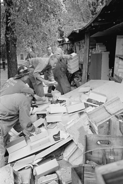 A gas explosion demolishes the Kellor's Store and Garage near Oregon. Oregon firemen and neighbors are shown trying to salvage shoes that were part of the store's inventory.